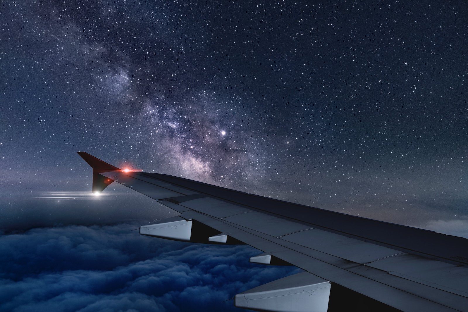 A breathtaking view of the night sky as seen from the airplane window.