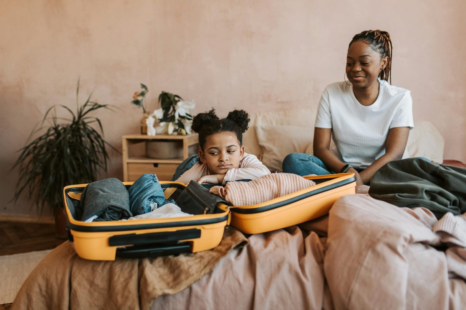 Family packing and preparing for a vacation trip
