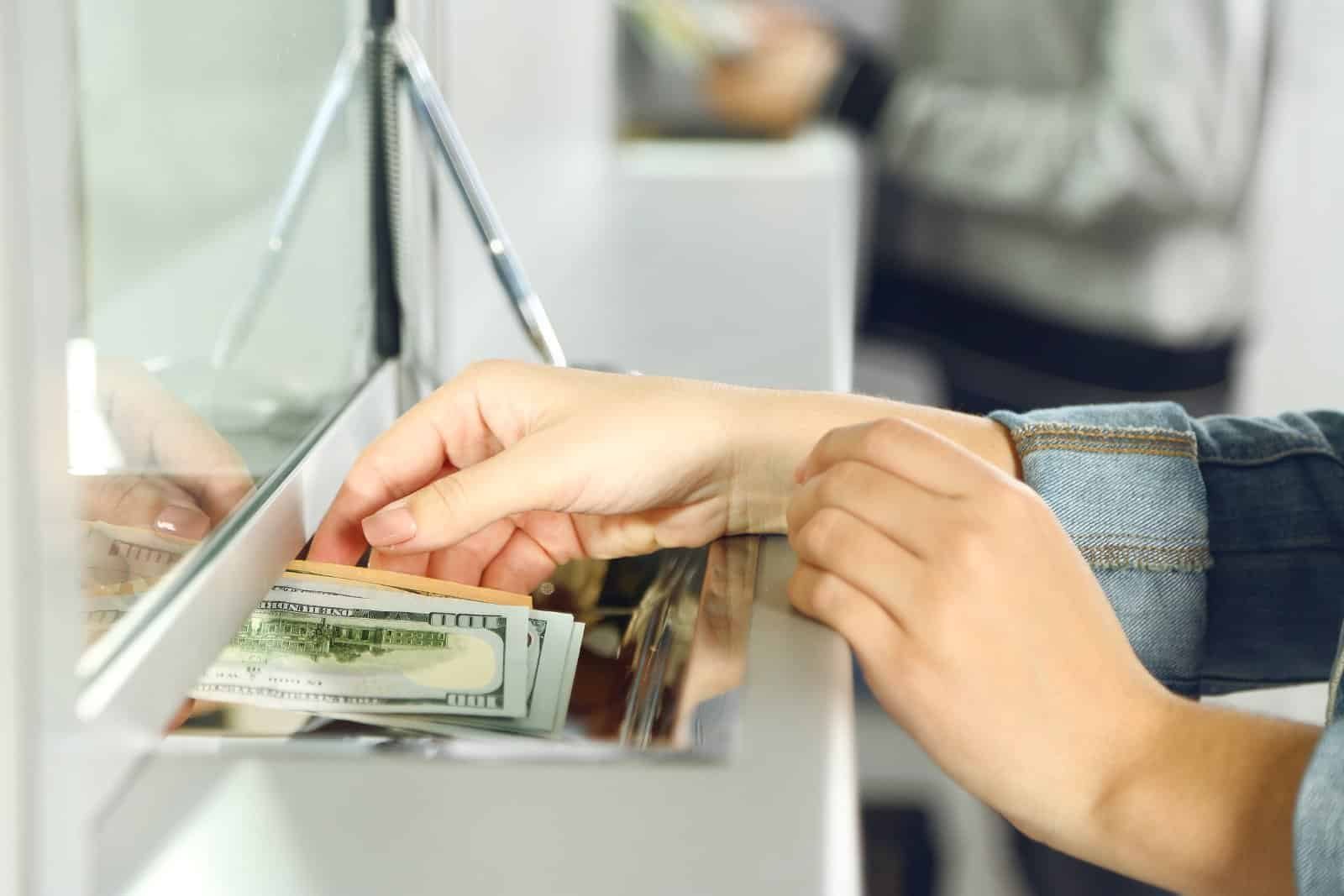 Traveler reviewing budget and currency exchange while abroad