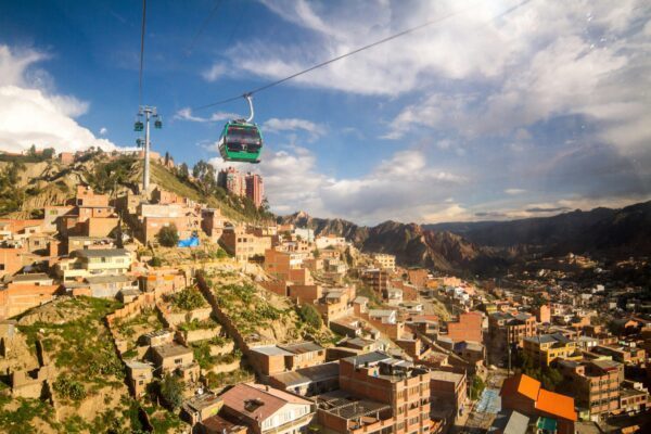 gondola riding over a city built on a hill