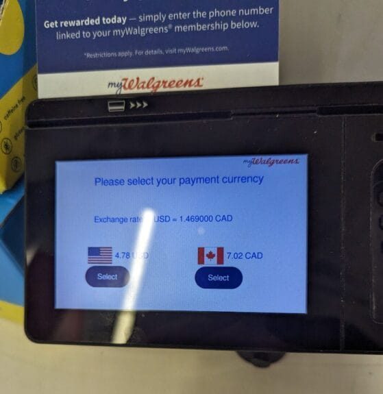 Traveler reviewing a receipt and exchange rate while abroad