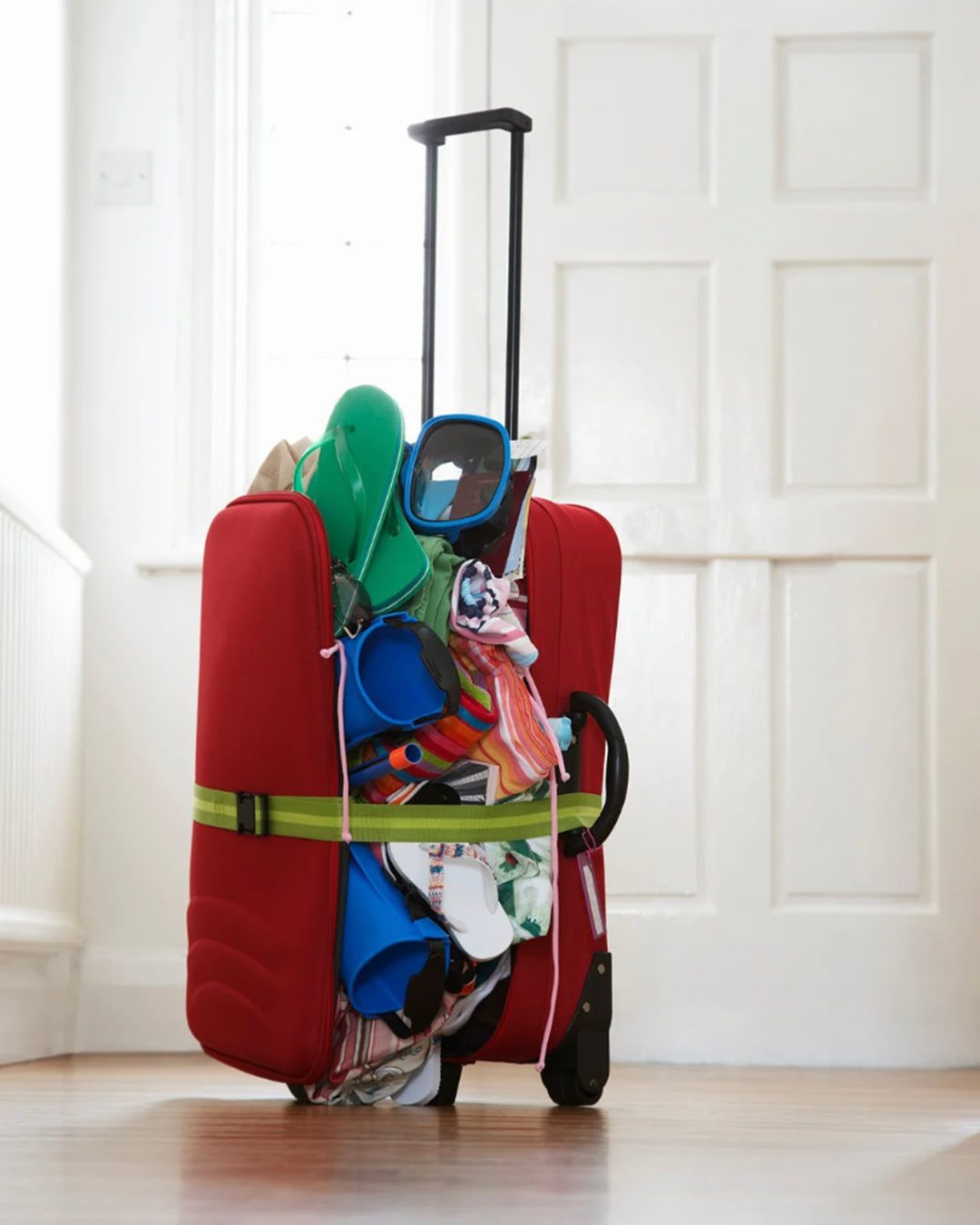 Oversized and overstuffed suitcase on the floor