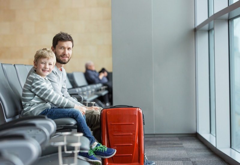 Passengers waiting during a layover inside an airport terminal