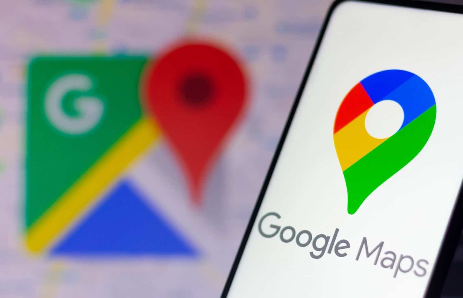 Google Maps icon on smartphone screen with blurred map background
