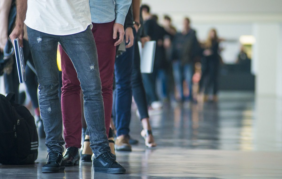 People waiting in line representing long immigrant visa wait times