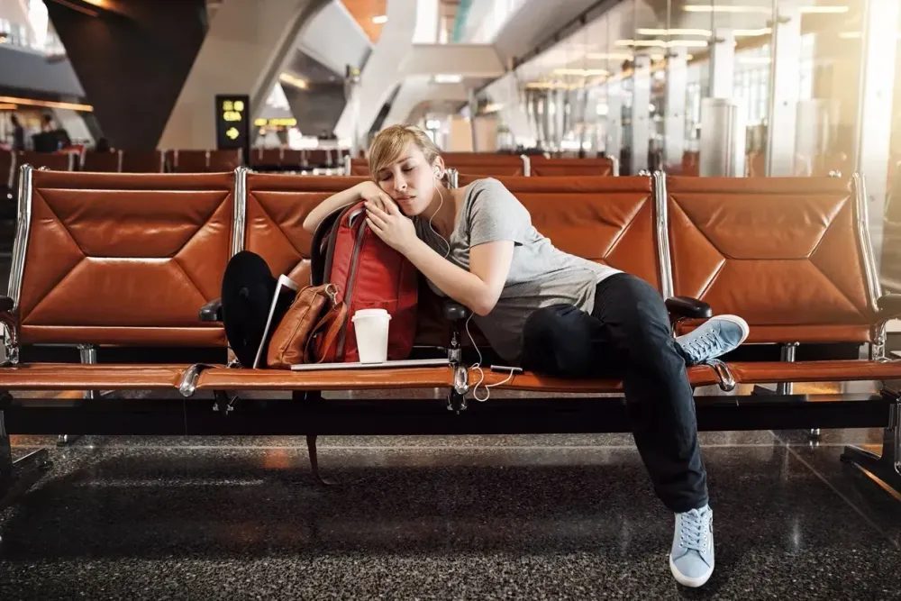 Traveler checking baggage rules and fees before a budget flight