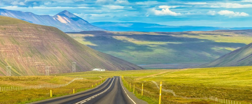 Empty road in a scenic landscape, symbolizing flexibility of driving
