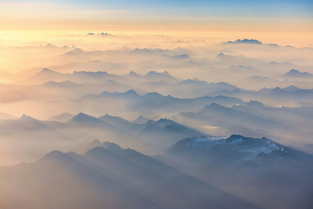 Sunlight breaking through clouds as seen from an airplane