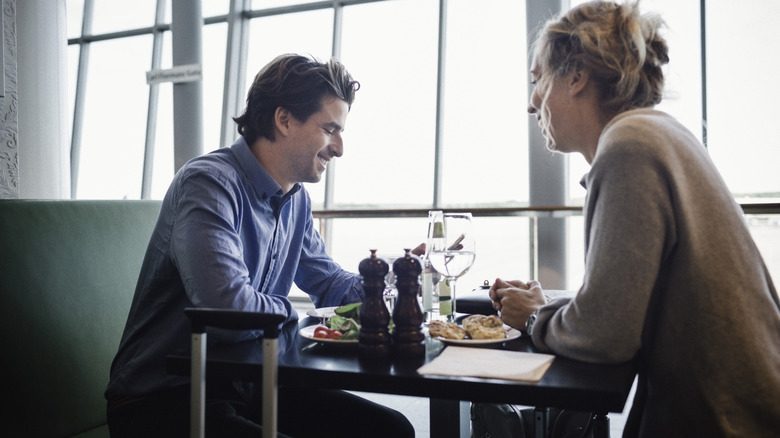 Travelers eating in an airport