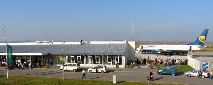 Secondary airport far from the main city, illustrating long onward travel