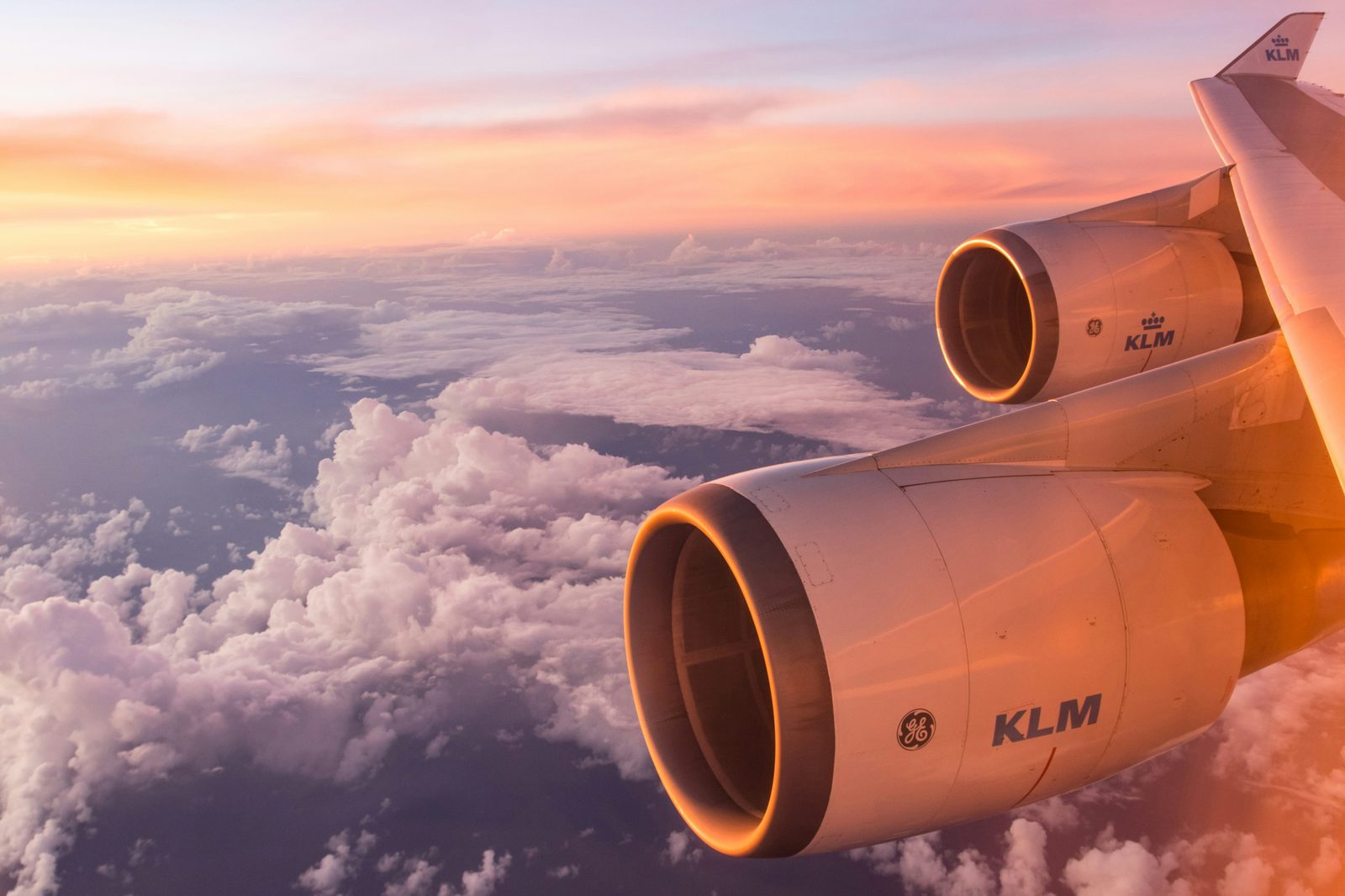 View of an airplane wing in flight over the ocean near Curacao