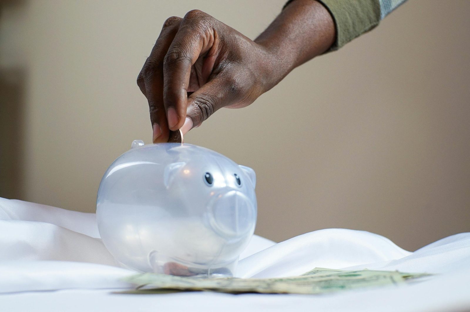 Saving money for family travel with a piggy bank