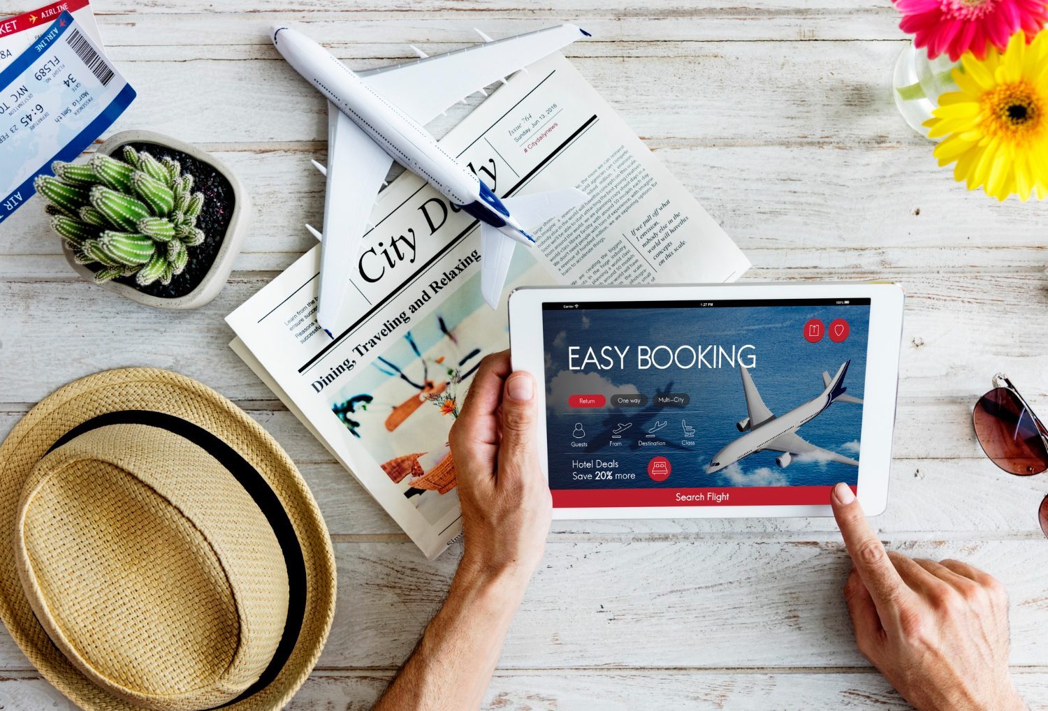 Traveler comparing flight prices on a laptop with currency and calendar icons