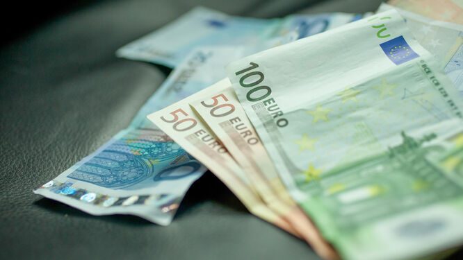 Euro banknotes withdrawn from an ATM for travel expenses