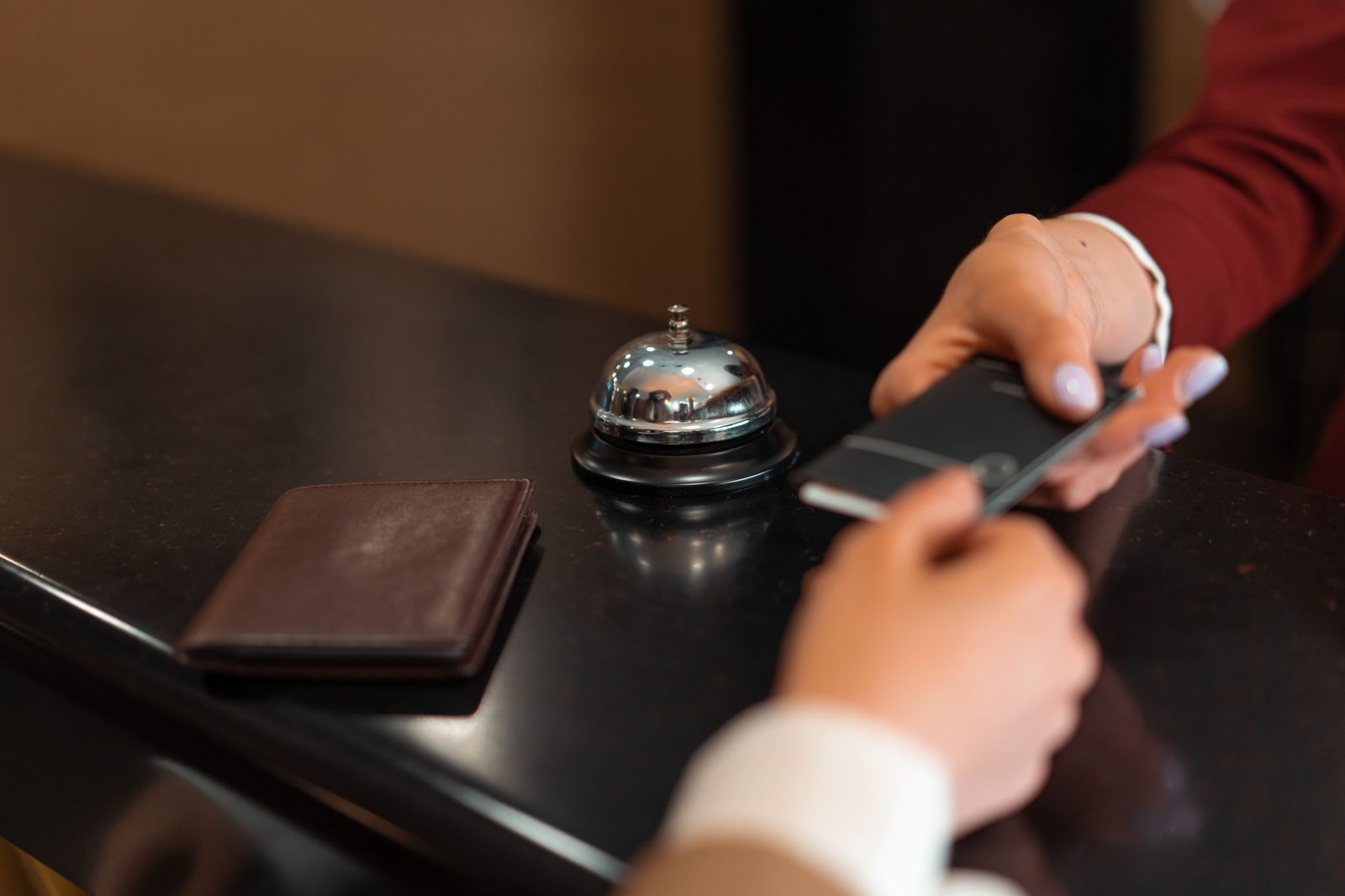Hotel check-in with smartphone and card transaction