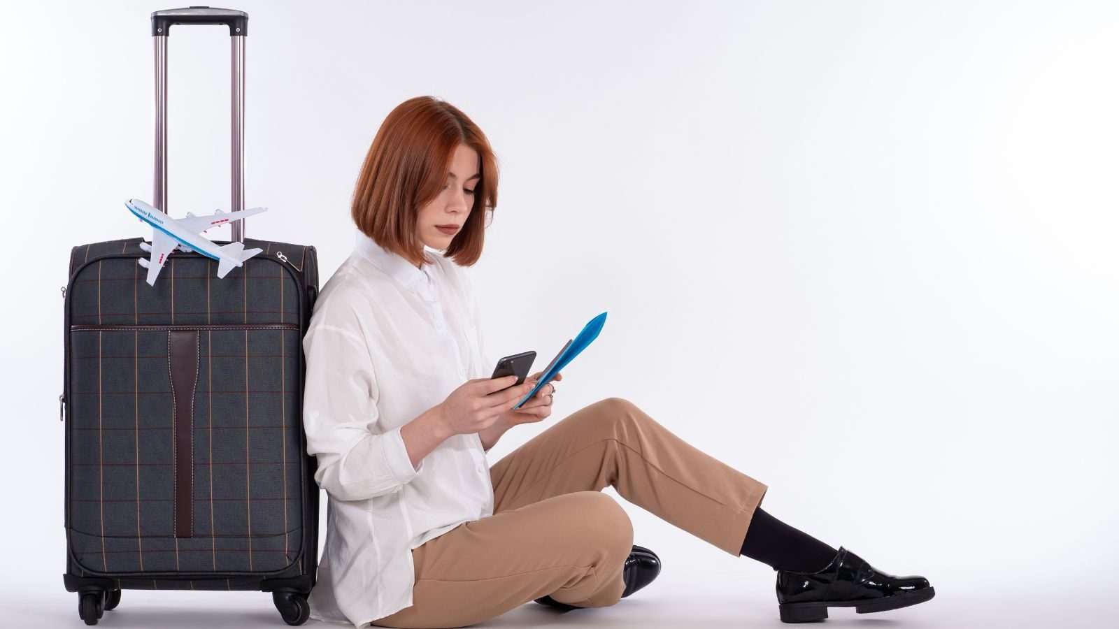 Traveler reviewing accommodation options and associated fees on a laptop