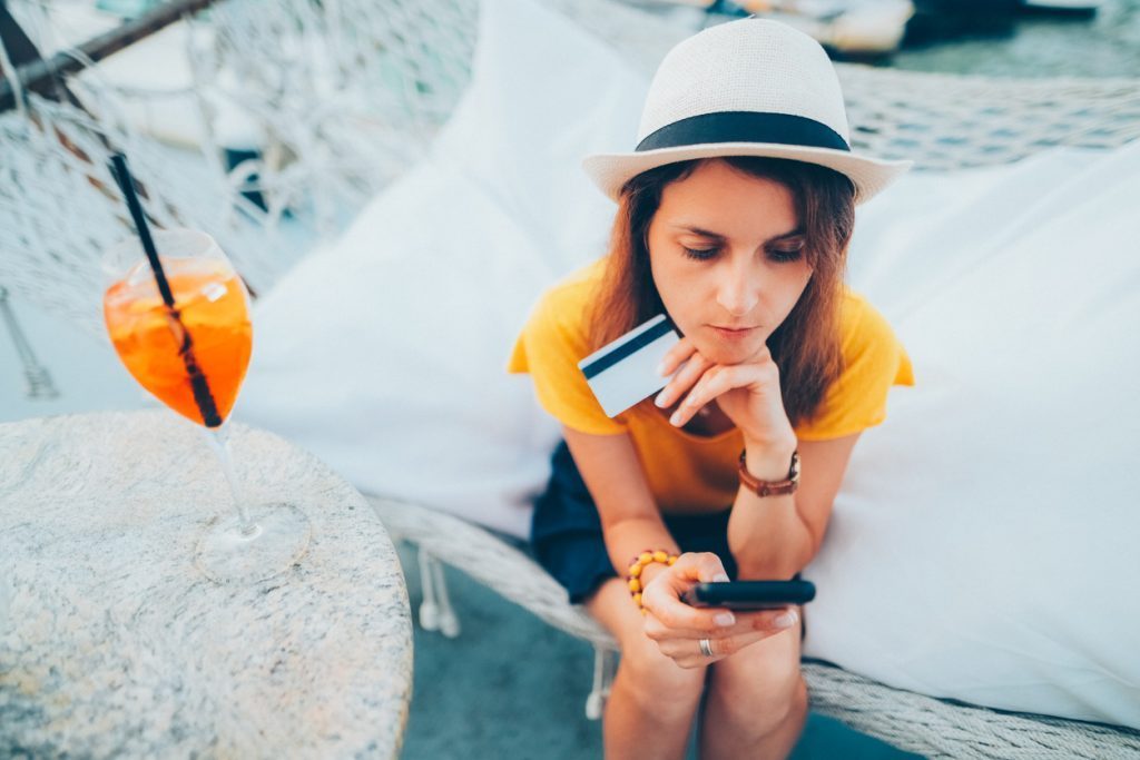 Traveler checking phone and documents at the airport