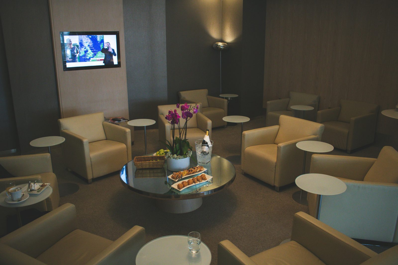 Travelers relaxing in an airport lounge area.