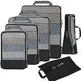 Compression packing cubes organized in a suitcase for light, last-minute travel