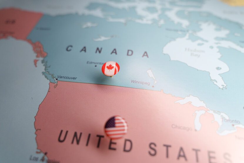 Airliner at a Canadian airport gate, illustrating shifting capacity between U.S. and domestic routes.