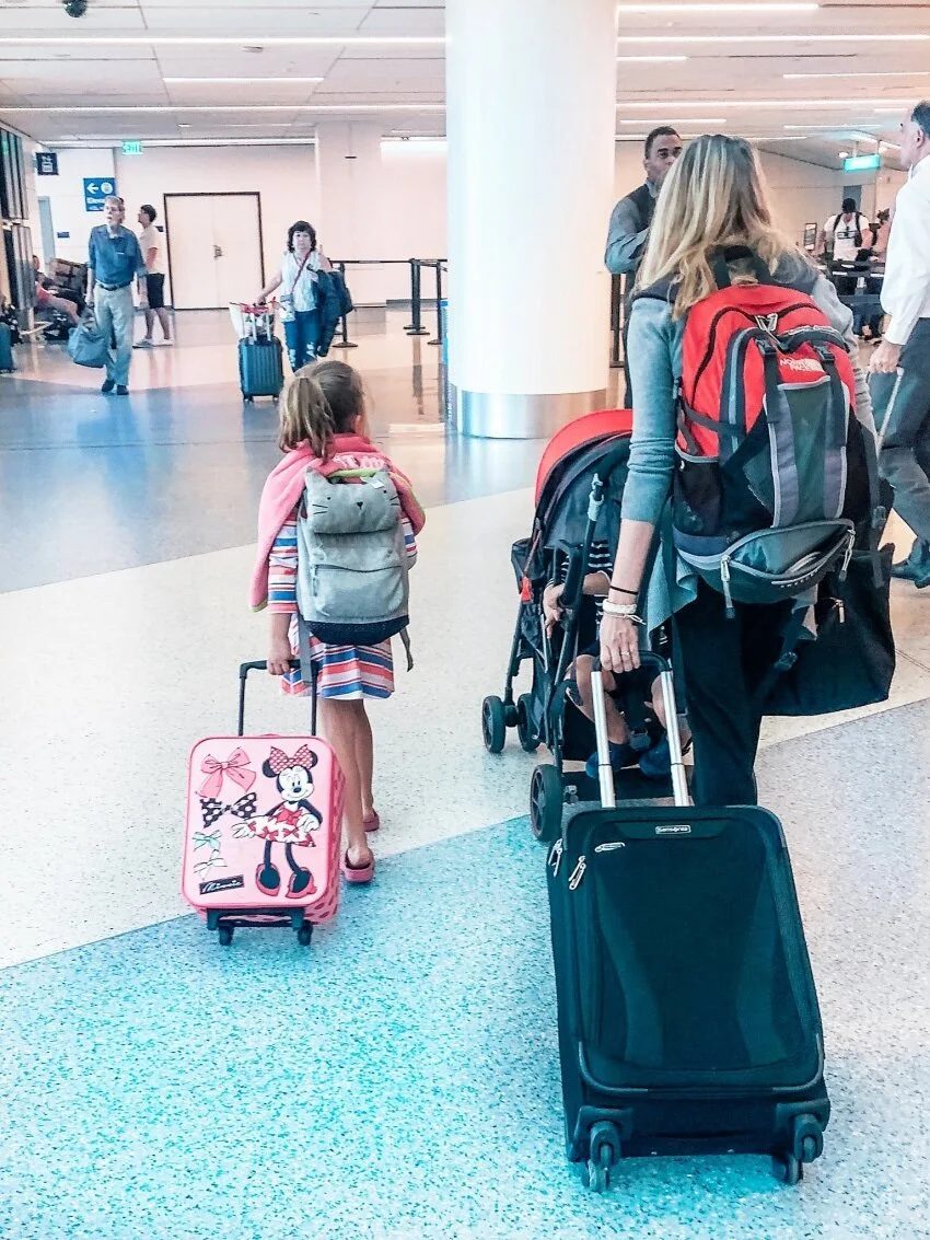 Kids in an airport, illustrating family air travel