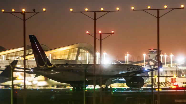 An airplane taxiing at night